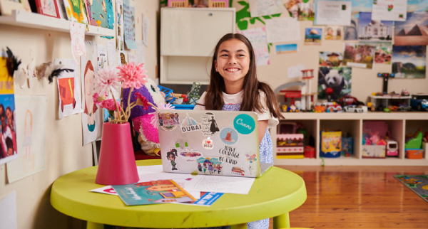 A girl using Canva at school.