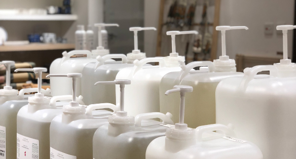 Slowood provided large containers with a pump nozzle for people to refill their own bottles of products for home use.